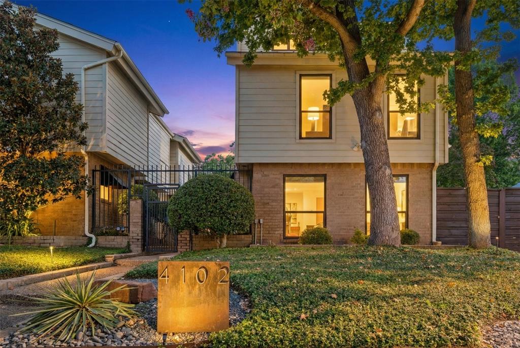 4102 Bowser Avenue, Unit 1 Dallas, TX 75219 - Photo 33 of 33 Corner-unit facade framed by mature trees and private gated entry