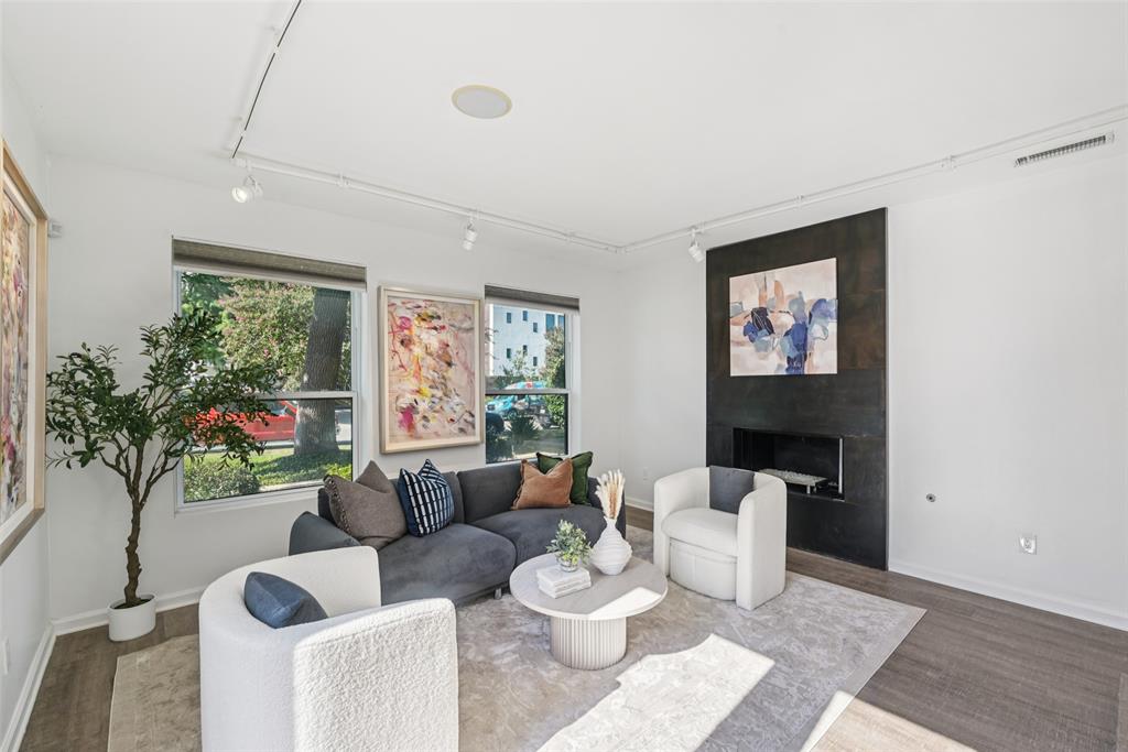 4102 Bowser Avenue, Unit 1 Dallas, TX 75219 - Photo 4 of 33 Expansive corner windows fill the main living space with natural light and neighborhood views