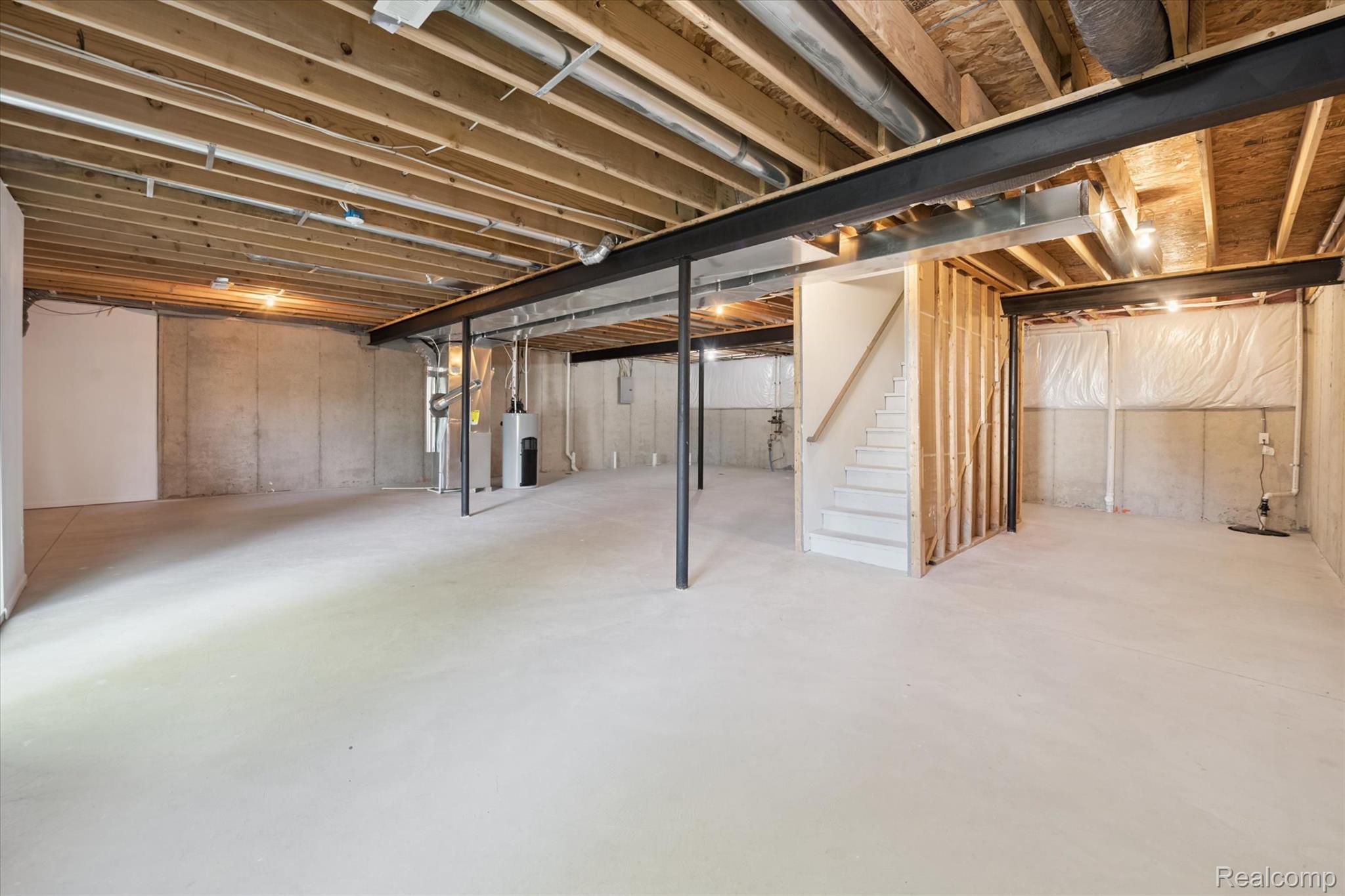 816 Nelson's Ridge Drive Howell, MI 48843 - Photo 22 of 36 Massive unfinished basement offering exceptional storage and future finishing potential.