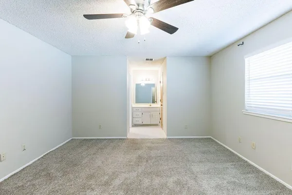 a bathroom with a double vanity sink and mirror