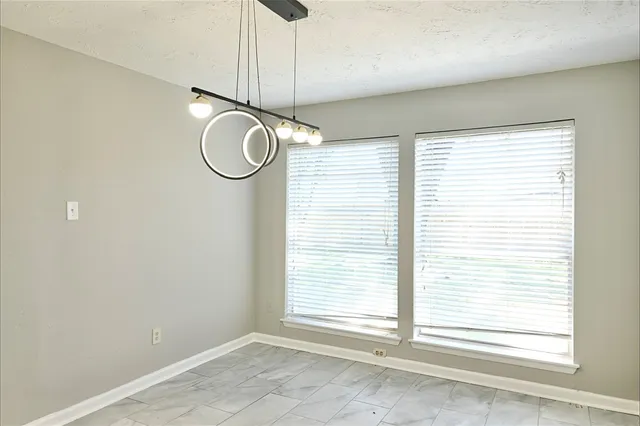 a view of empty room with windows