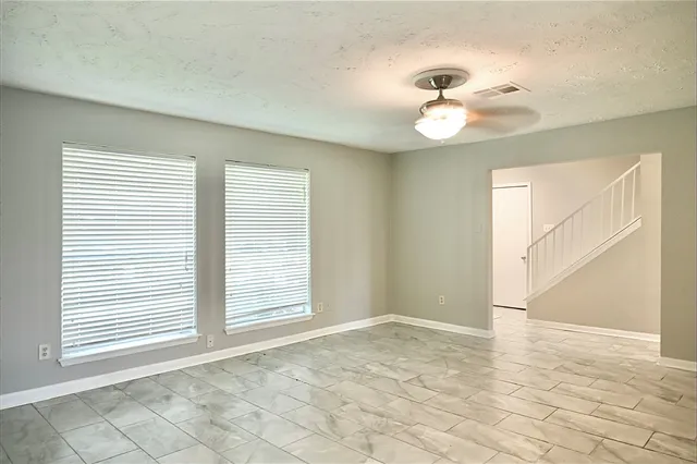a view of an empty room with a window