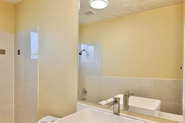 a bathroom with a sink and a toilet