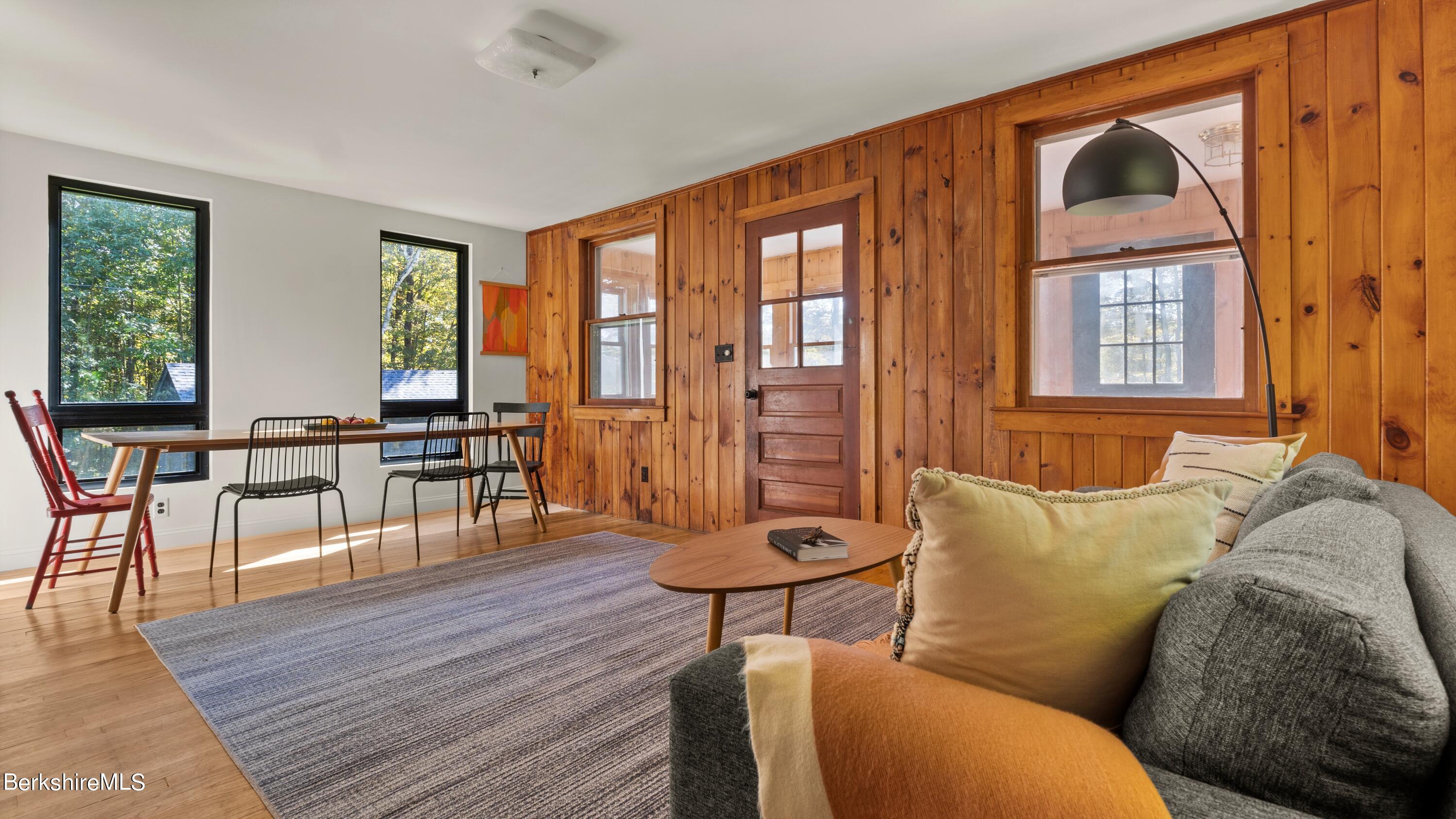 50 Hupi Road Monterey, MA 01245 - Photo 8 of 27 a living room with furniture and a floor to ceiling window