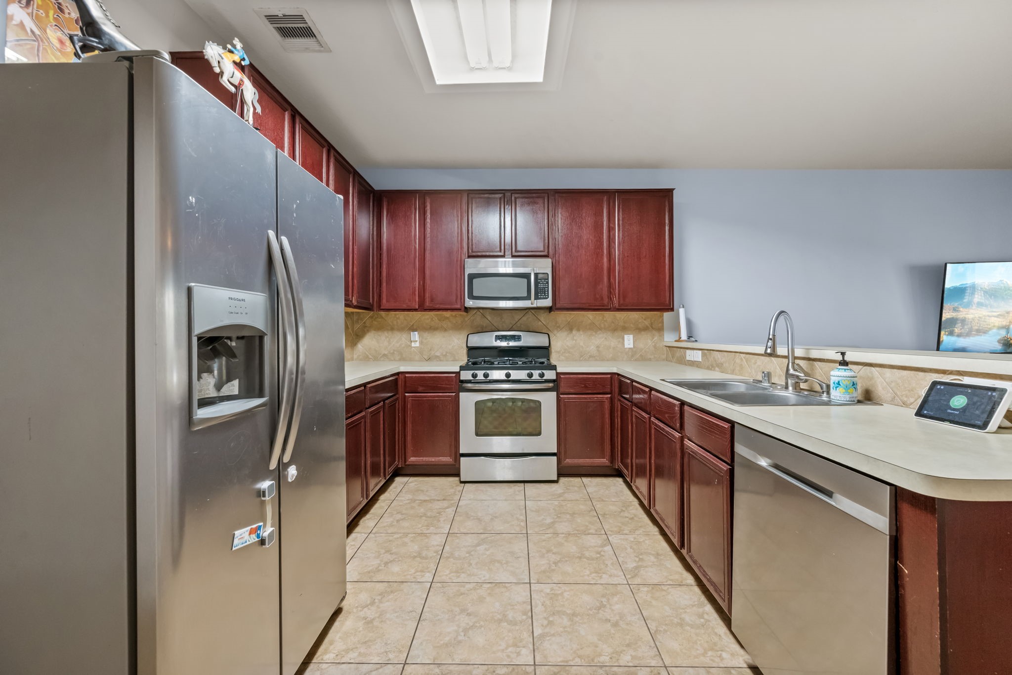 903 Northgate Springs Drive Spring, TX 77373 - Photo 5 of 31 Ample Cabinets and Countertops, including updated dishwasher!