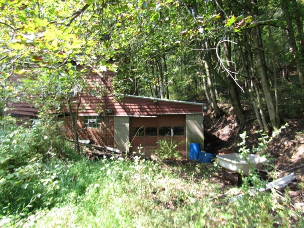 a view of a house with a tree