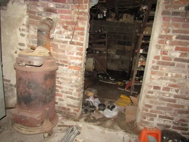 a bed room with a bed and a window