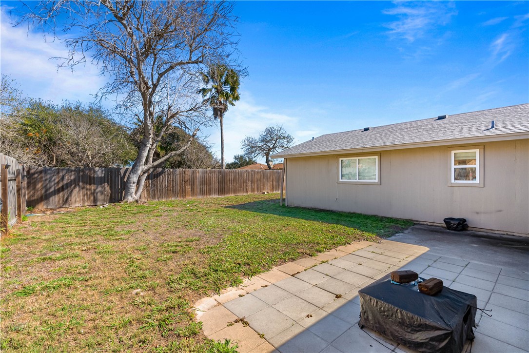 985 Ribbontail Street Corpus Christi, TX 78418 - Photo 14 of 15 a view of a backyard with a garden