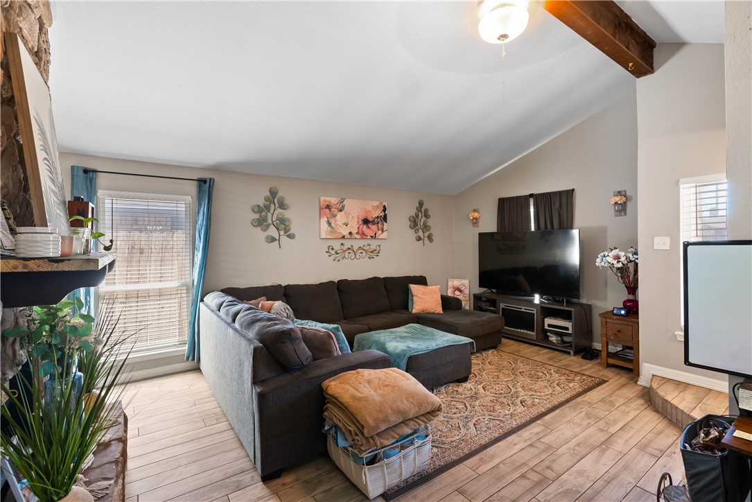 985 Ribbontail Street Corpus Christi, TX 78418 - Photo 4 of 15 a living room with furniture and a flat screen tv