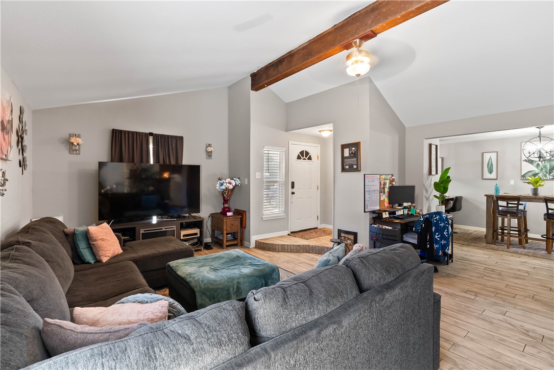 985 Ribbontail Street Corpus Christi, TX 78418 - Photo 5 of 15 a living room with furniture and a flat screen tv