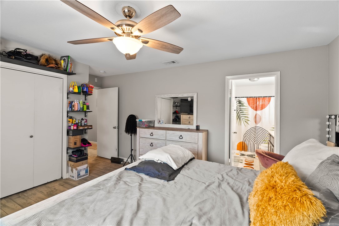 985 Ribbontail Street Corpus Christi, TX 78418 - Photo 8 of 15 a bedroom with a bed and a window