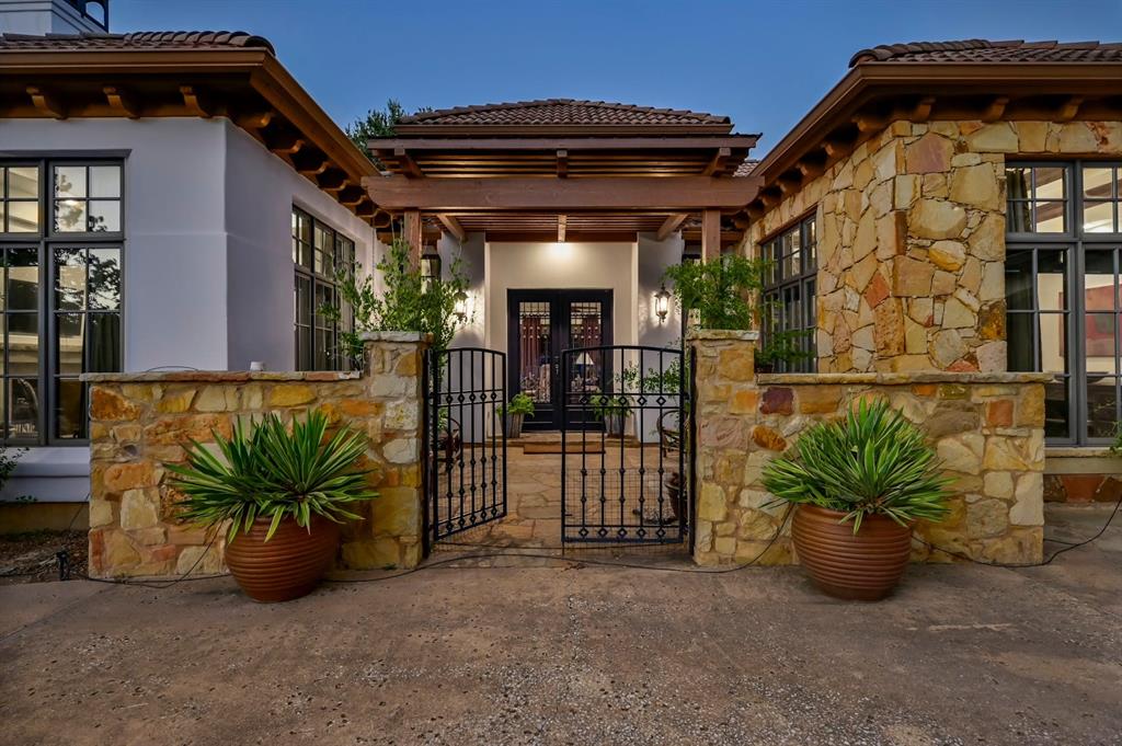 a view of a porch with potted plants