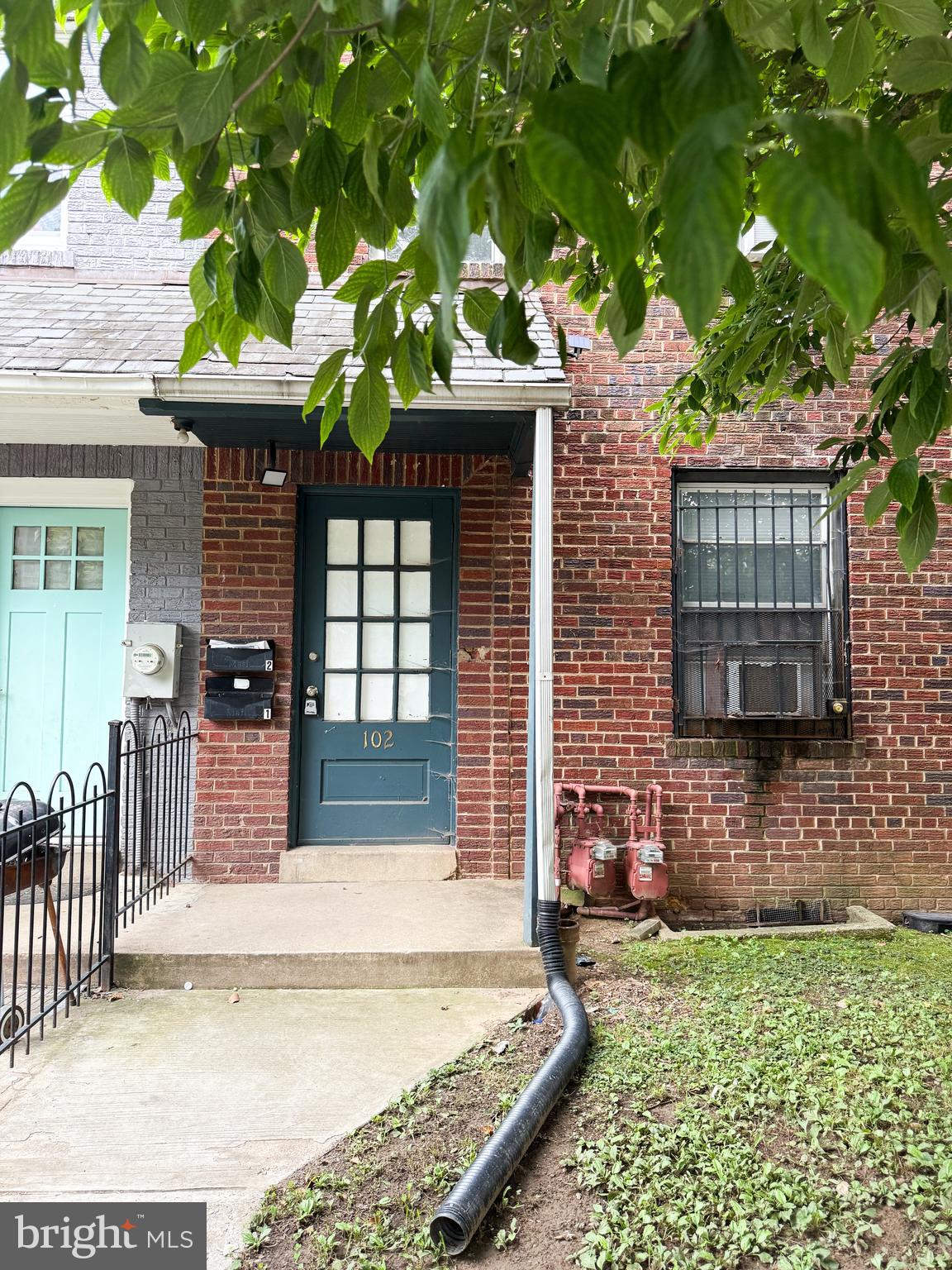 102 O Street Southwest, Unit 1 Washington, DC 20024 - Photo 1 of 7 a view of house with backyard and a tree