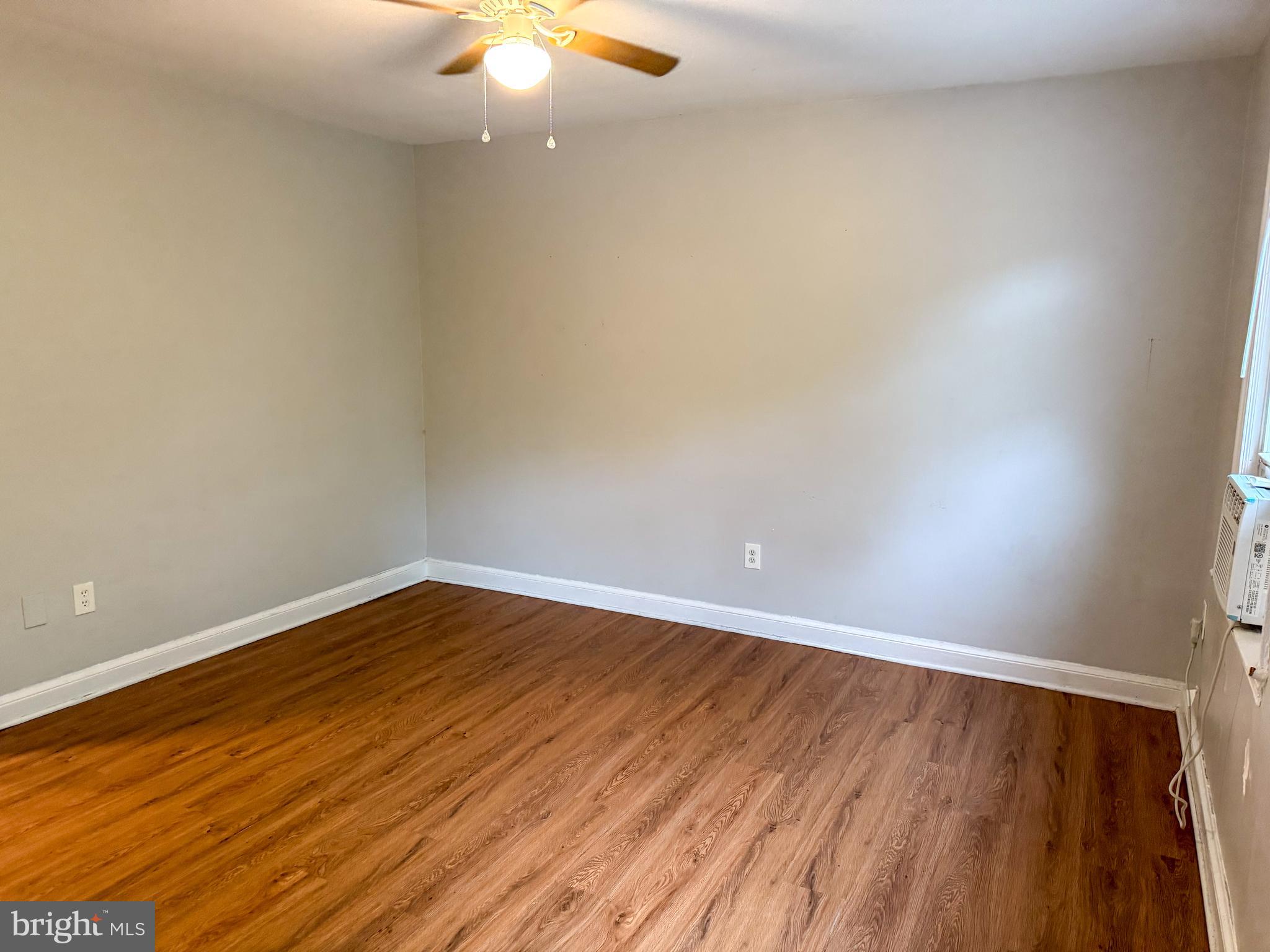 102 O Street Southwest, Unit 1 Washington, DC 20024 - Photo 5 of 7 a view of an empty room with wooden floor