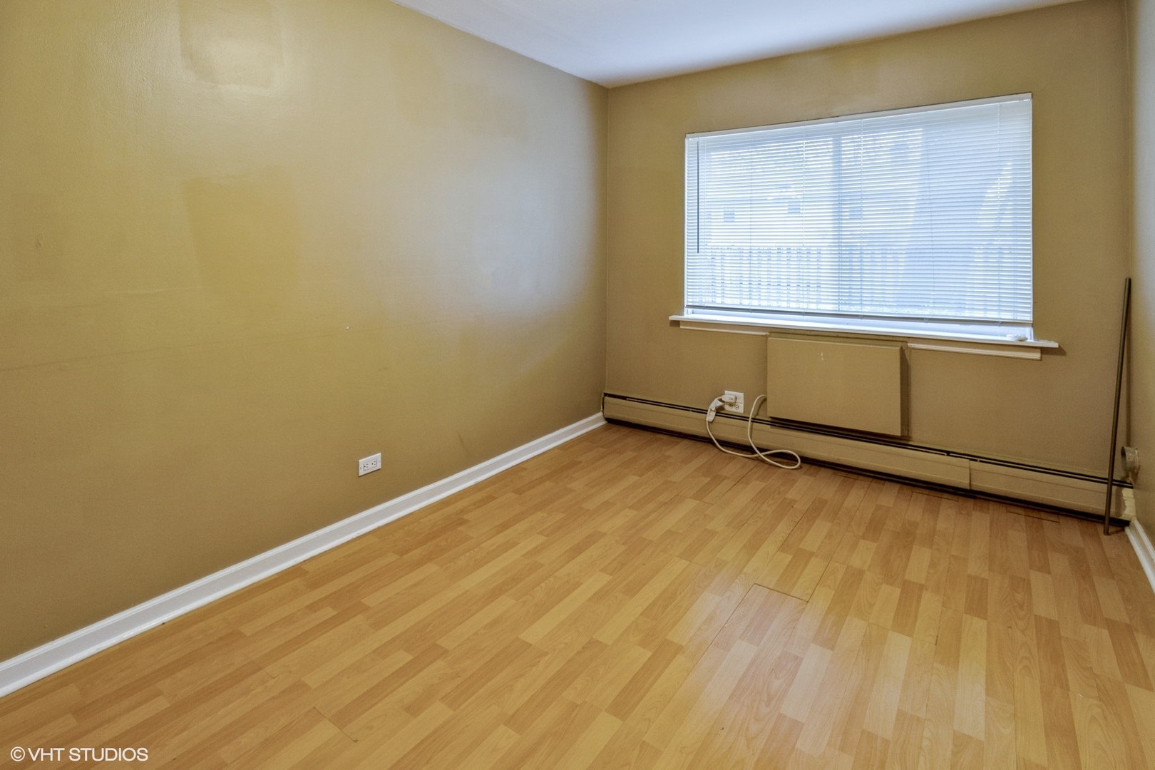 2323 South Goebbert Road, Unit 109 Arlington Heights, IL 60005 - Photo 8 of 11 an empty room with windows