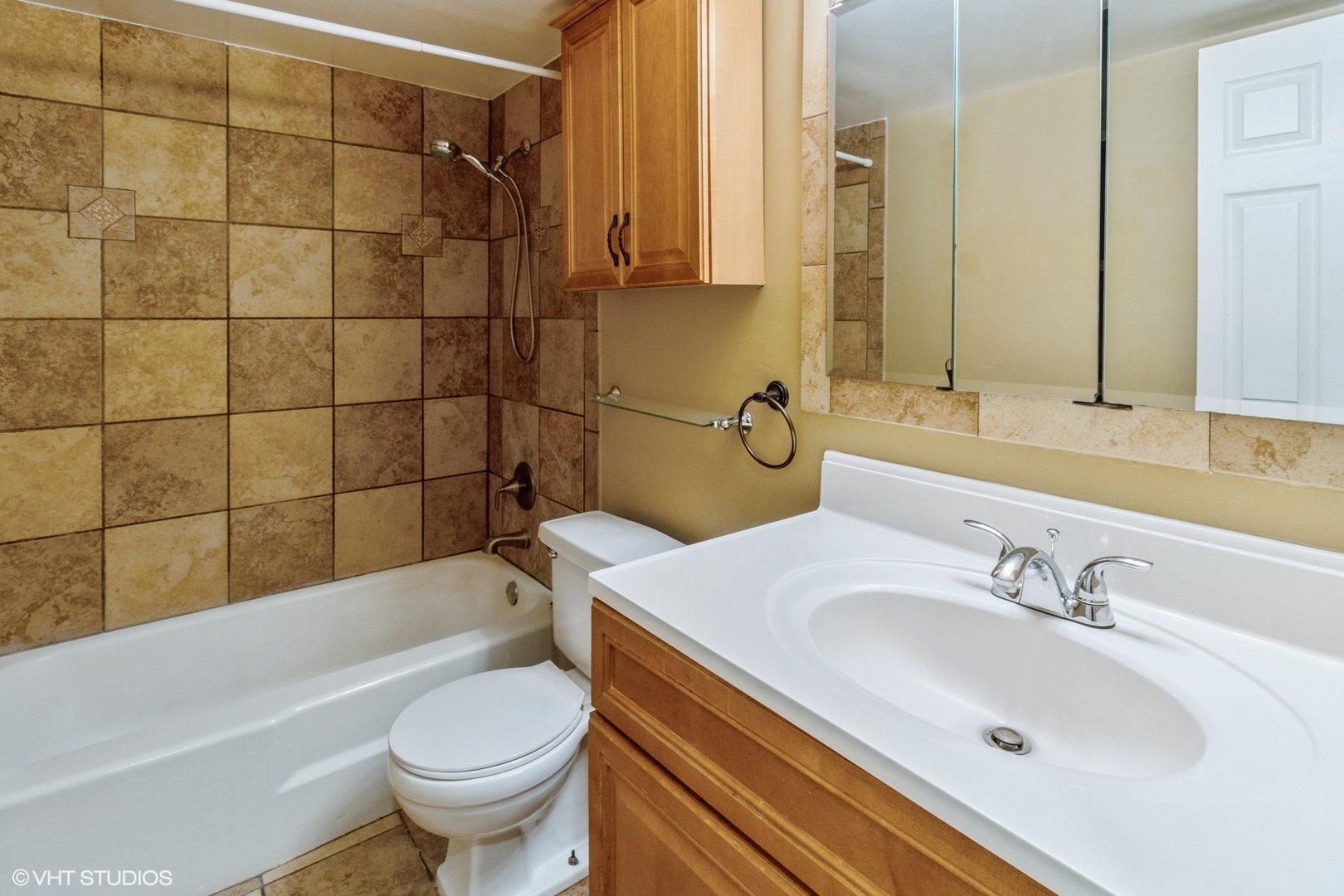 2323 South Goebbert Road, Unit 109 Arlington Heights, IL 60005 - Photo 9 of 11 a bathroom with a sink toilet and shower