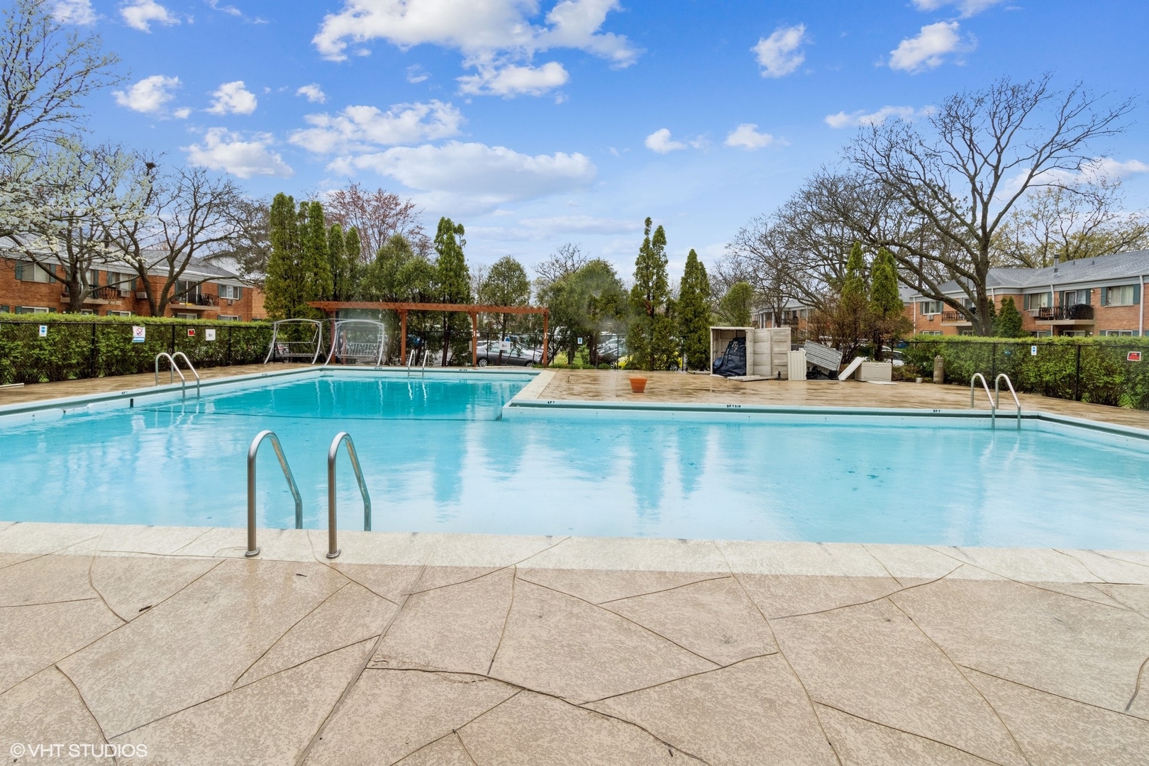 2323 South Goebbert Road, Unit 109 Arlington Heights, IL 60005 - Photo 10 of 11 a view of a swimming pool with a lake