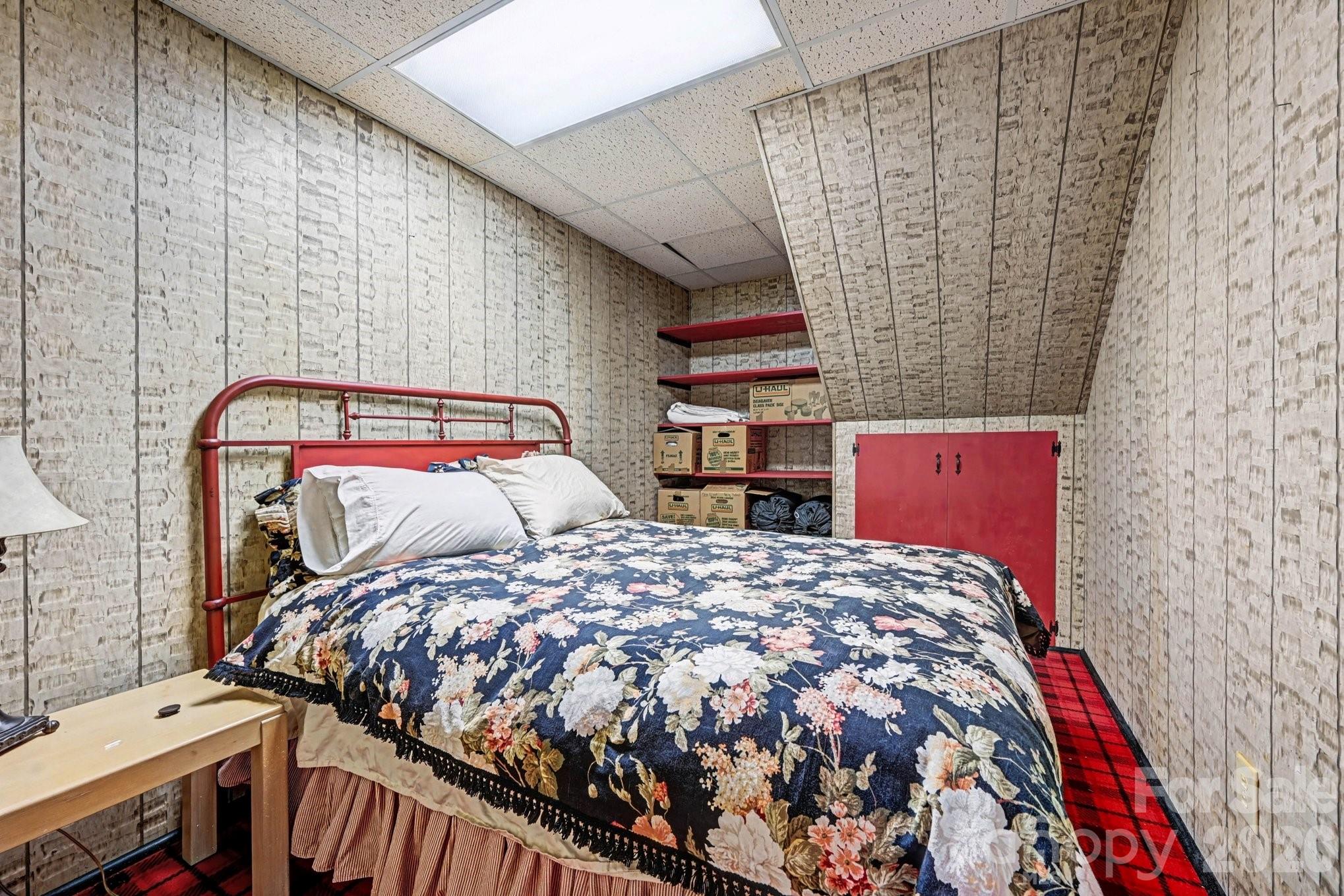 2915 Old Stage Road Gastonia, NC 28052 - Photo 15 of 42 a bedroom with a bed and a chandelier