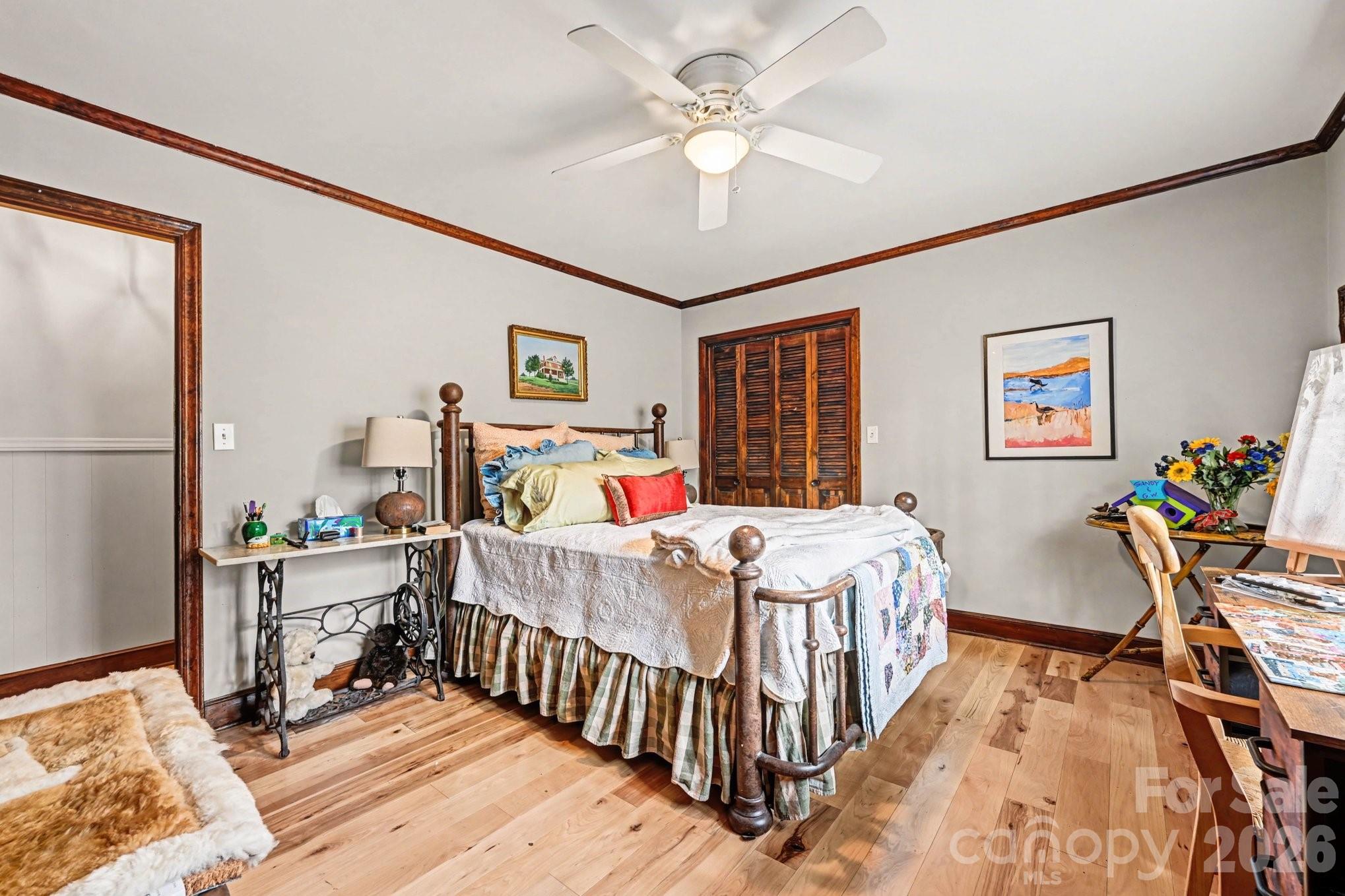 2915 Old Stage Road Gastonia, NC 28052 - Photo 16 of 42 a bedroom with a bed and a chandelier