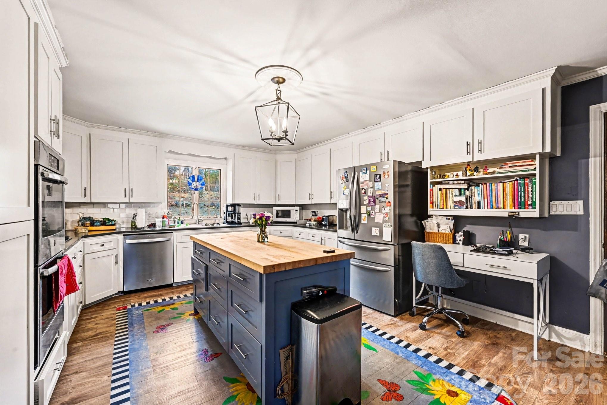 2915 Old Stage Road Gastonia, NC 28052 - Photo 20 of 42 a kitchen with kitchen island granite countertop a sink appliances and cabinets