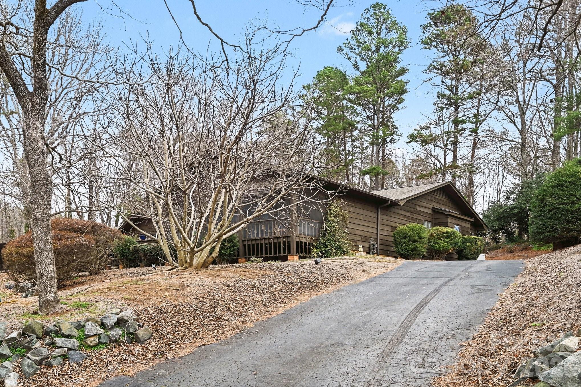 2915 Old Stage Road Gastonia, NC 28052 - Photo 23 of 42 a front view of a house with a yard covered in snow