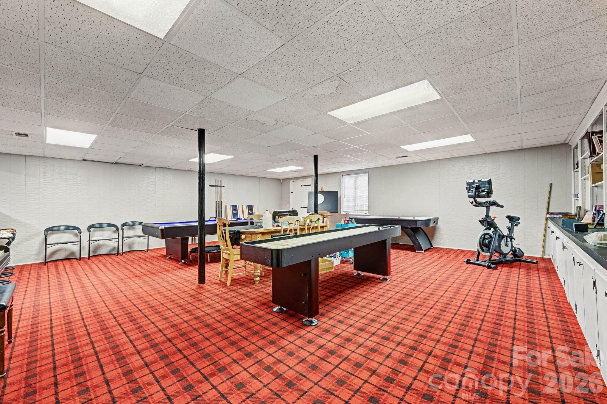 2915 Old Stage Road Gastonia, NC 28052 - Photo 33 of 42 a room with lots of furniture and wooden floors