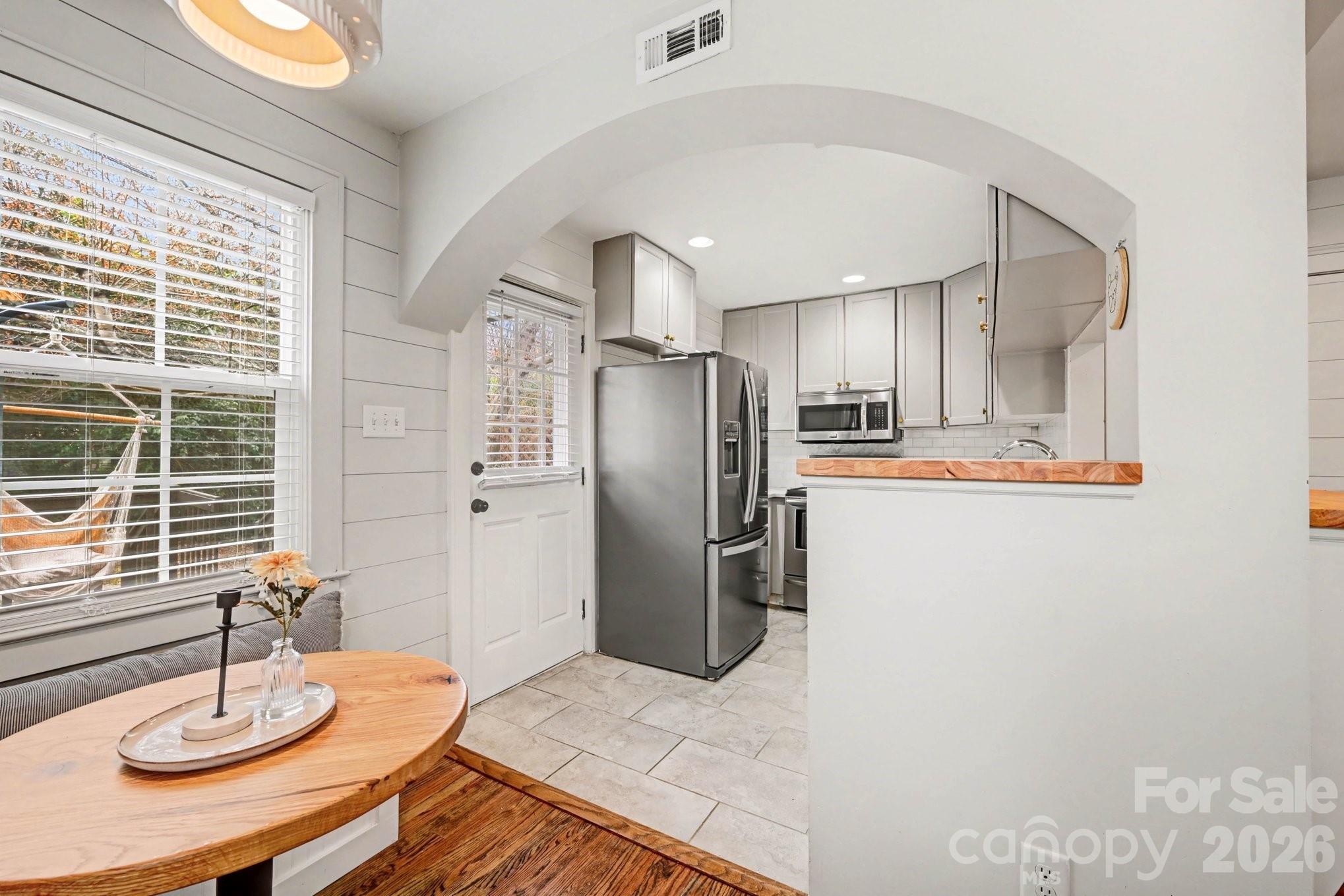 2915 Old Stage Road Gastonia, NC 28052 - Photo 6 of 42 a kitchen with stainless steel appliances kitchen island granite countertop a refrigerator a stove and a sink with granite countertops