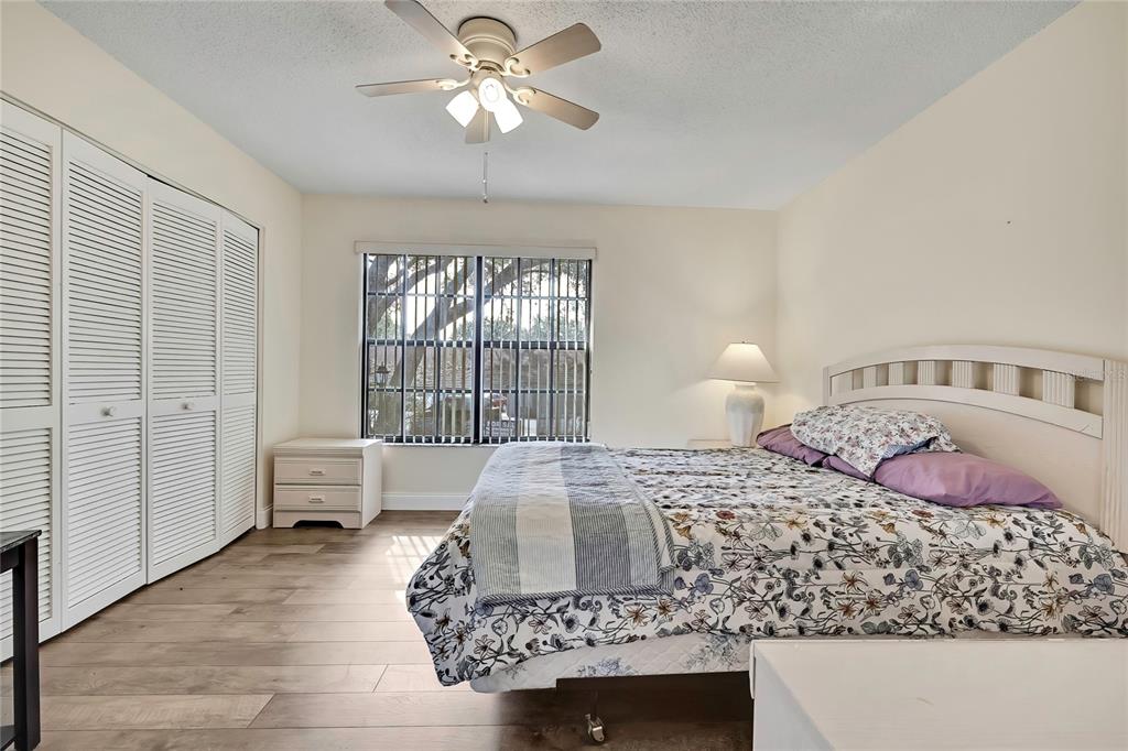 6365 Nature Preserve Lane Spring Hill, FL 34606 - Photo 13 of 26 a bedroom with a bed and dresser with mirror