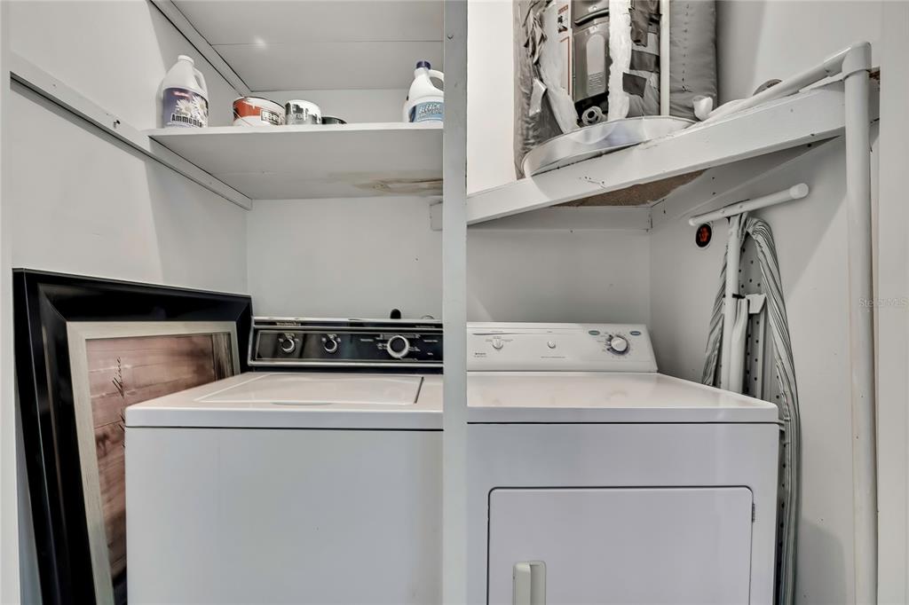 6365 Nature Preserve Lane Spring Hill, FL 34606 - Photo 17 of 26 a utility room with dryer and washer
