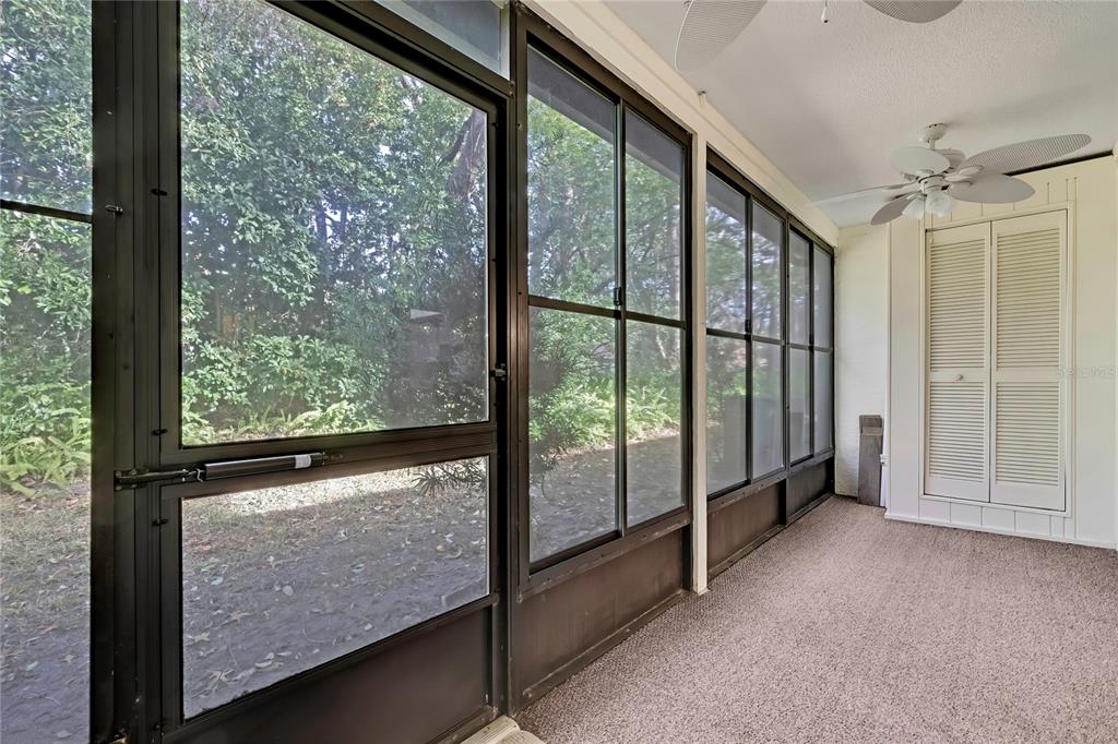 6365 Nature Preserve Lane Spring Hill, FL 34606 - Photo 18 of 26 a view of a room with wooden floor and windows