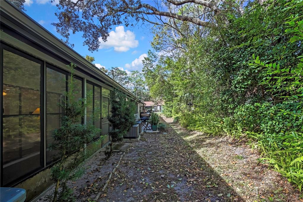 6365 Nature Preserve Lane Spring Hill, FL 34606 - Photo 24 of 26 a backyard of a house with lots of green space