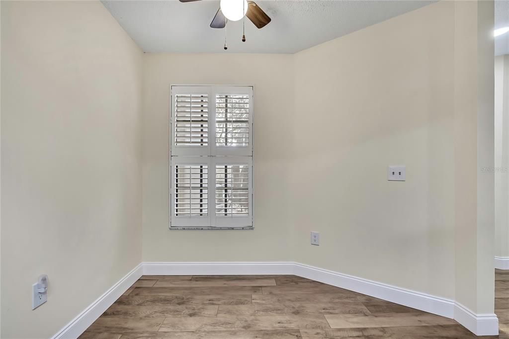 6365 Nature Preserve Lane Spring Hill, FL 34606 - Photo 7 of 26 an empty room with windows