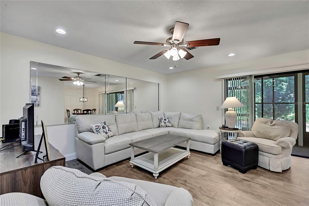 6365 Nature Preserve Lane Spring Hill, FL 34606 - Photo 9 of 26 a living room with furniture and a large window