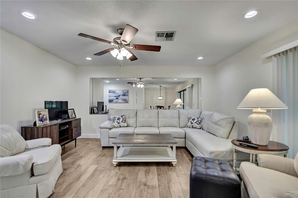 6365 Nature Preserve Lane Spring Hill, FL 34606 - Photo 10 of 26 a living room with furniture and a lamp