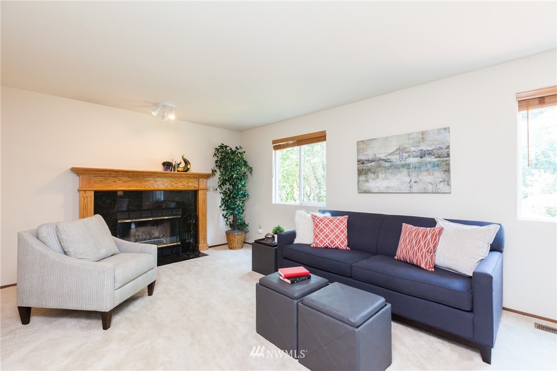 907 Field Avenue Northeast Renton, WA 98059 - Photo 14 of 22 a living room with furniture and a fireplace