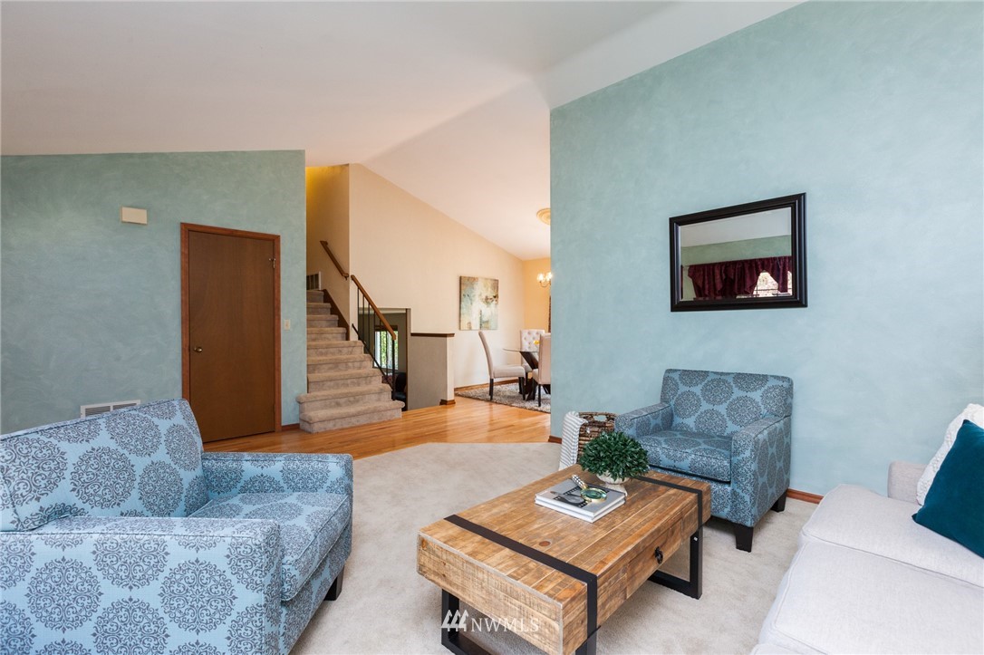 907 Field Avenue Northeast Renton, WA 98059 - Photo 3 of 22 a living room with furniture and wooden floor