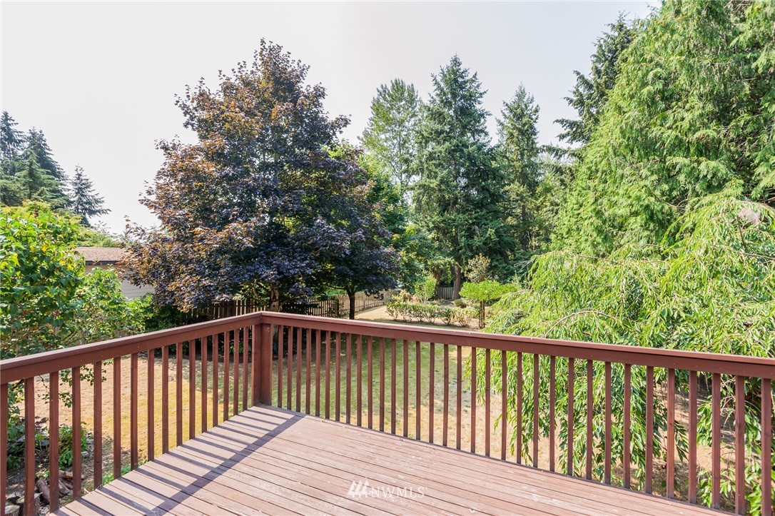 907 Field Avenue Northeast Renton, WA 98059 - Photo 22 of 22 a view of balcony with wooden floor and fence