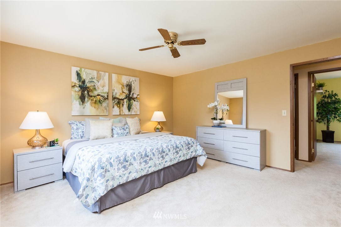 907 Field Avenue Northeast Renton, WA 98059 - Photo 8 of 22 a bedroom with a bed and a painting on the wall