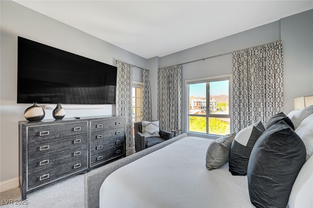 30 Strada Di Villaggio, Unit 250 Henderson, NV 89011 - Photo 21 of 52 Carpeted bedroom with baseboards