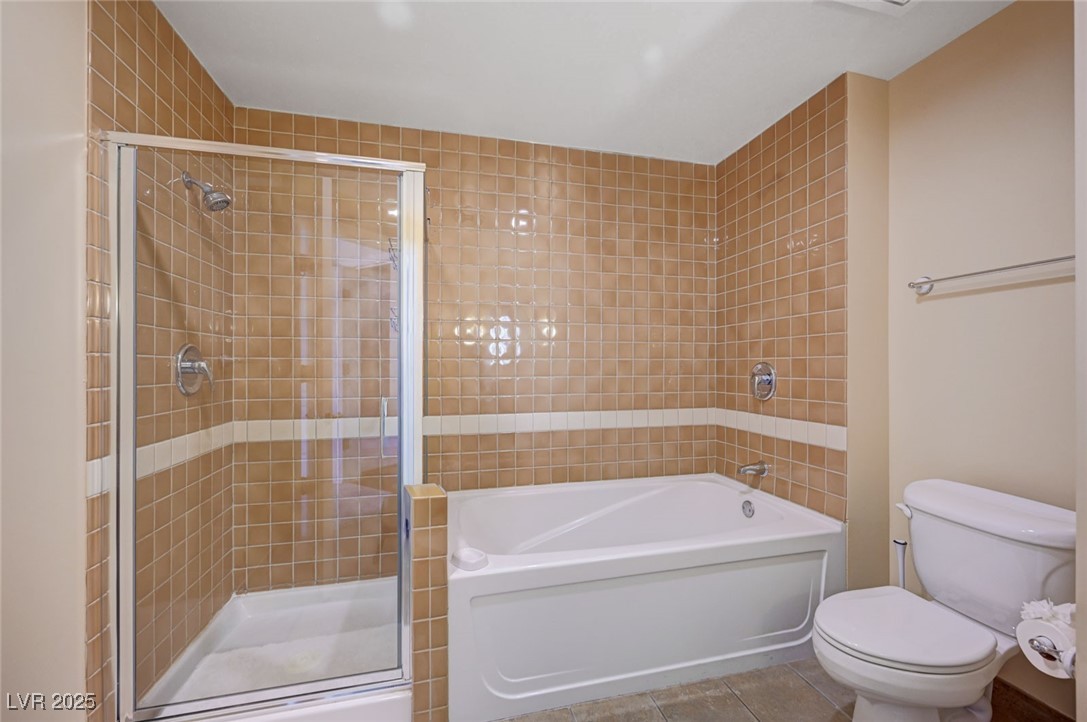 30 Strada Di Villaggio, Unit 250 Henderson, NV 89011 - Photo 26 of 52 Bathroom featuring a stall shower, tile patterned floors, and a bath