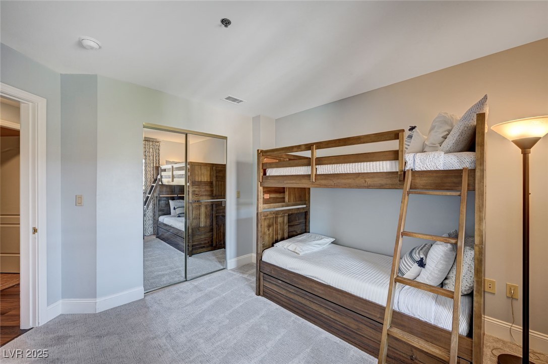 30 Strada Di Villaggio, Unit 250 Henderson, NV 89011 - Photo 27 of 52 Carpeted bedroom with baseboards and a closet