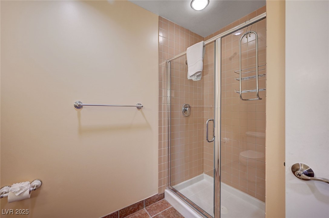 30 Strada Di Villaggio, Unit 250 Henderson, NV 89011 - Photo 30 of 52 Bathroom featuring a stall shower and tile patterned floors