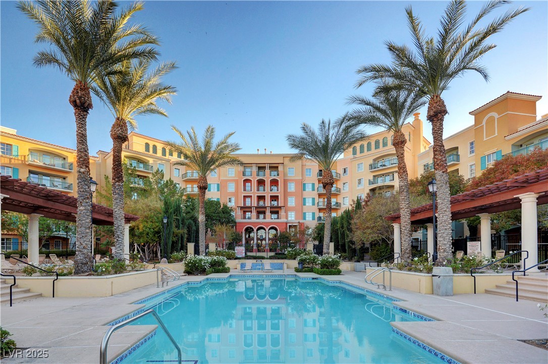 30 Strada Di Villaggio, Unit 250 Henderson, NV 89011 - Photo 43 of 52 Community pool with a pergola and a patio area