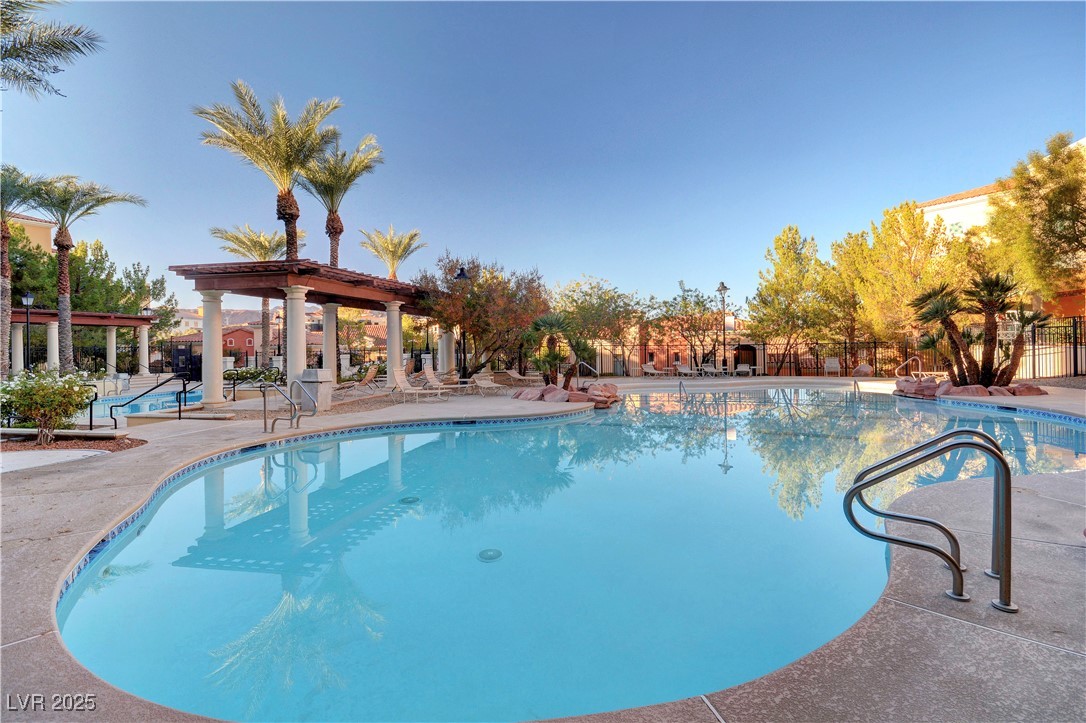 30 Strada Di Villaggio, Unit 250 Henderson, NV 89011 - Photo 44 of 52 Community pool with a patio