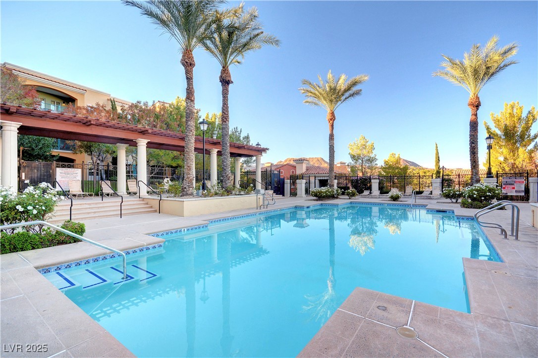 30 Strada Di Villaggio, Unit 250 Henderson, NV 89011 - Photo 45 of 52 Community pool featuring a patio and a pergola