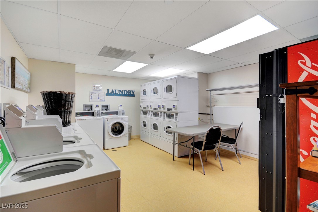 30 Strada Di Villaggio, Unit 250 Henderson, NV 89011 - Photo 48 of 52 Community laundry room with a drop ceiling, separate washer and dryer, and stacked washer / dryer
