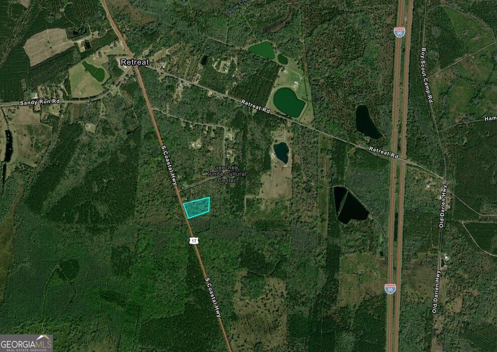 5.8-acres South Coastal Highway Riceboro, GA 31323 - Photo 2 of 2 a bird view of a house