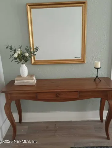 a view of storage and utility room with a refrigerator