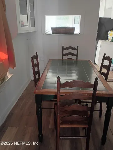 a stove top oven sitting inside of a kitchen