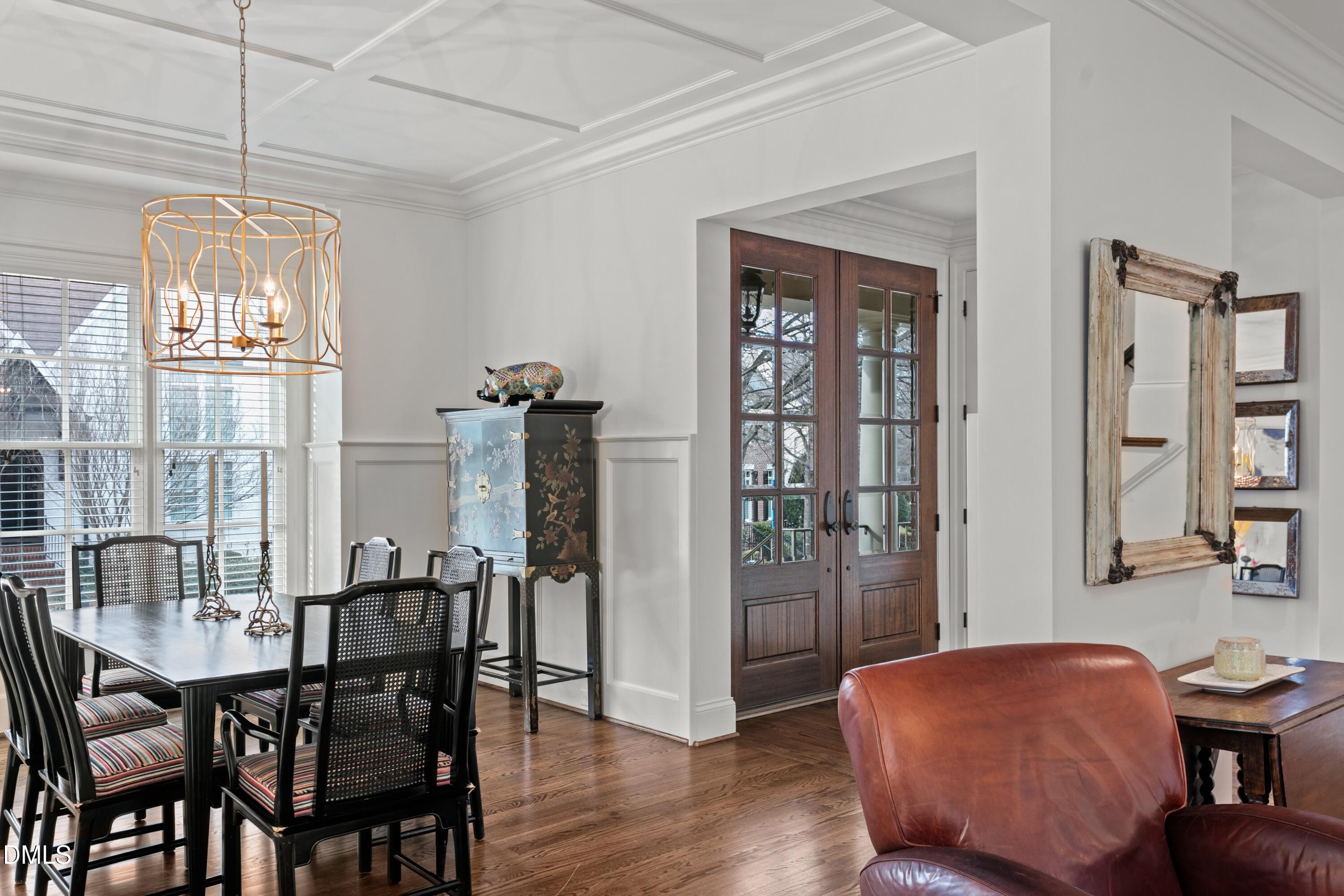 514 Wayne Drive Raleigh, NC 27608 - Photo 11 of 53 a view of a dining room with furniture and chandelier